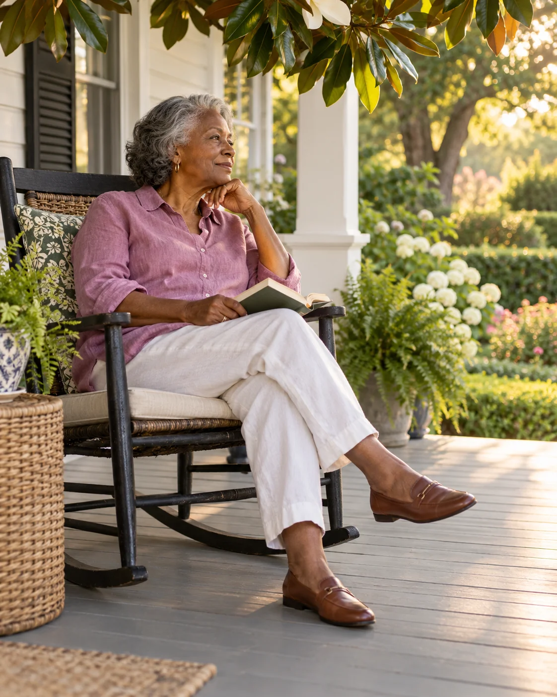 Illustrative scene of an older woman reading on a sunlit porch